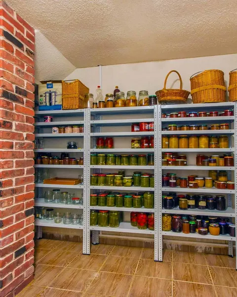 Preppers: a well-stocked pantry of home-preserved food in jars, ready for emergencies